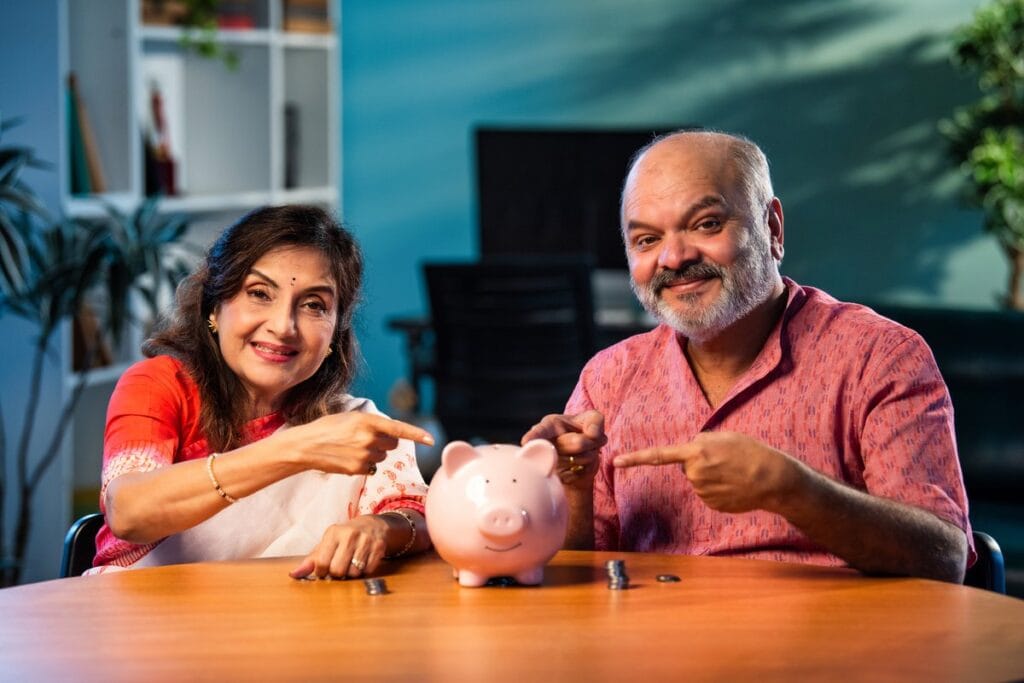 PPF Calculator - Indian couple managing PPF savings with coins
