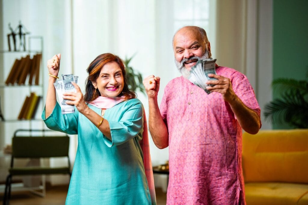 Retirement Calculator - Happy senior couple celebrating retirement