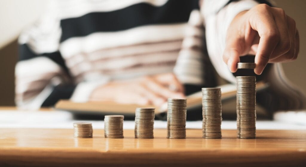 SIP Calculator - Systematic Investment Plan showing growing returns with coin stacks