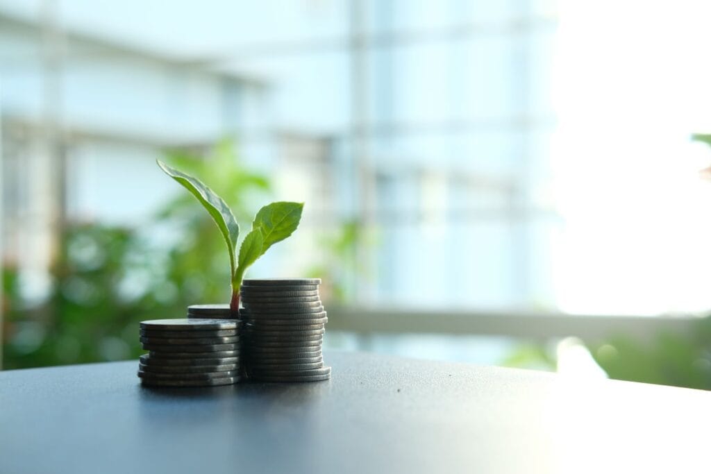 SIP vs mutual fund — a small plant growing from stacked coins, symbolizing disciplined SIP investing